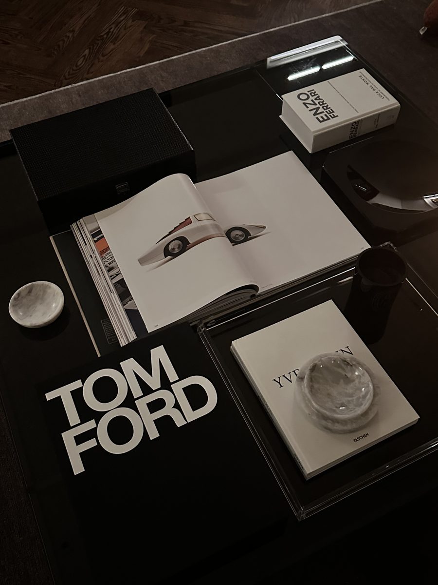 Dark lacquer coffee table with Tom Ford and Ferrari books